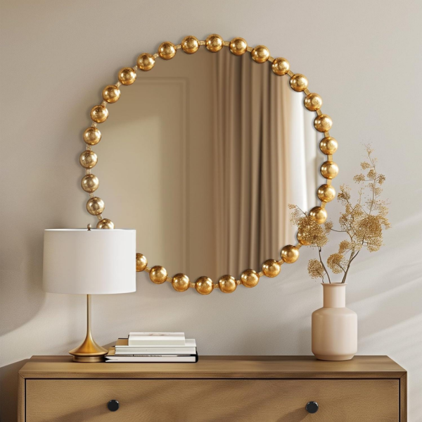 Round gold-tone metal-framed wall mirror, 27 inches in diameter—suitable for hallways, living rooms, or vanity areas.