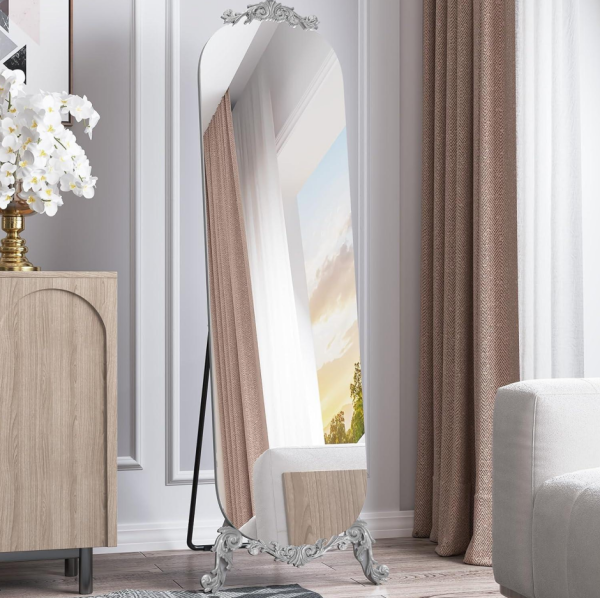 Frameless Arched Floor Mirror, 61.5" x 20", featuring a silver finish and a freestanding stand